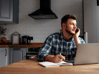 Young male freelancer works from home