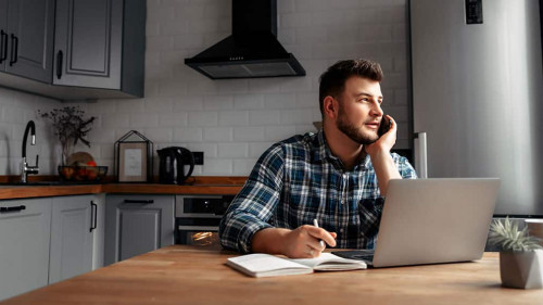 Young male freelancer works from home