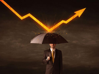 Businessman standing with umbrella keeping orange arrow