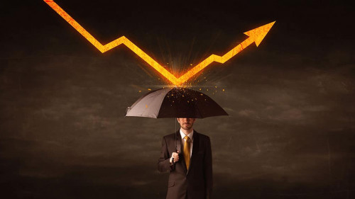 Businessman standing with umbrella keeping orange arrow