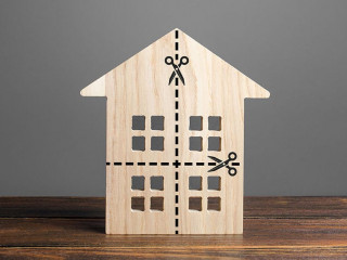 Residential building divided by a dotted line into four equal parts. Distribution of the right. Divorce concept. Disputes over division process of real estate and property after divorce.