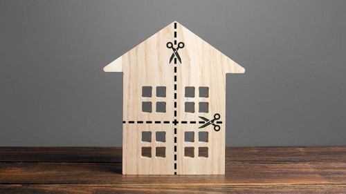 Residential building divided by a dotted line into four equal parts. Distribution of the right. Divorce concept. Disputes over division process of real estate and property after divorce.