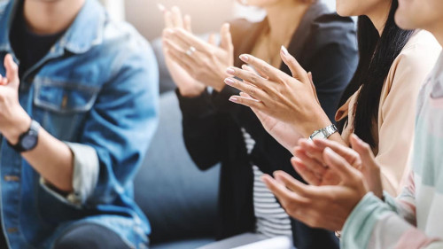 Business people applauding.