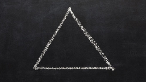 Triangle drawn with chalk on blackboard