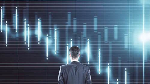 Thinking businessman standing near economic crisis stock charts