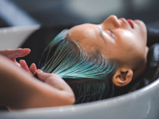 professional hairdresser woman are washing client hair in beauty salon, female head treatment and health care concept, person clean a hair by using water and shampoo to fashion hair care coiffure