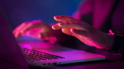 Computer and hands close up