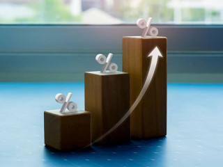 Shining rise up arrow on wooden cube blocks, bar graph chart ste