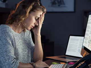 Stressed woman working over time at night