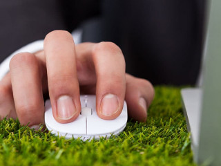 Businessman Using Laptop With Computer Mouse
