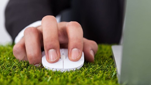 Businessman Using Laptop With Computer Mouse