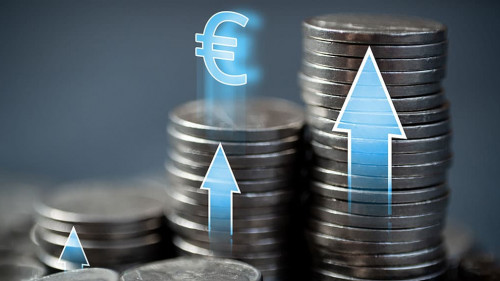 Economic growth in the European Union. Stacks of coins with up arrows and euro sign.