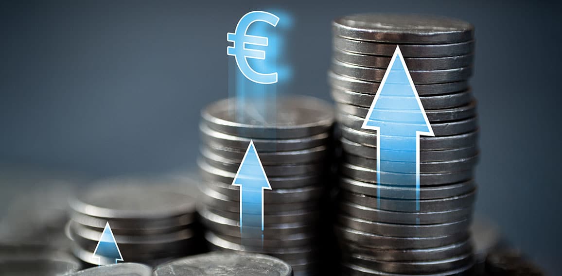 Economic growth in the European Union. Stacks of coins with up arrows and euro sign.