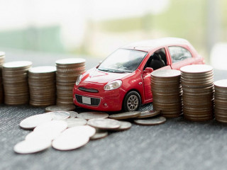 red car over a lot of stacked coins