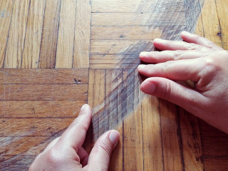 Old scratched surface of hardwood flooring in need of maintenance. parquet ruined by scratches made by prolonged use of chair.