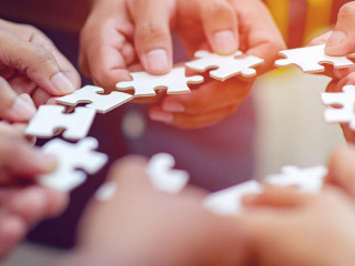 Team work, hands and jig Saw Unite with power Is a good team of