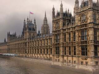 Houses of Parliament on the River Thames - with storm clouds.