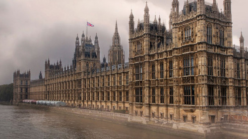 Houses of Parliament on the River Thames - with storm clouds.