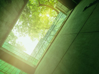 Eco-friendly building in the modern city. Sustainable glass offi