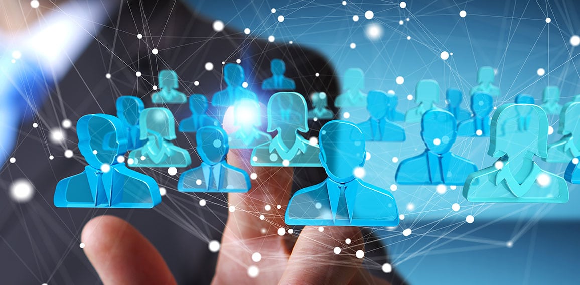 Businessman holding 3D rendering group of blue people