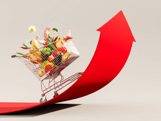 Food cost rising concept. Shopping cart full of groceries and re