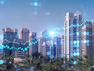 Panoramic view of steel and glass skyscrapers of Dubai Marina. Modern cityscape of the capital of the UAE. Financial services hub. FOREX graph and chart concept. Double exposure.