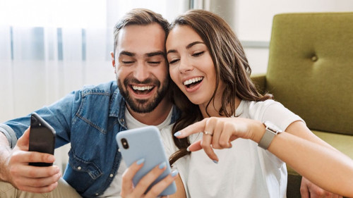 Beautiful young couple in love at home