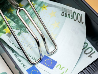 Cash register with coins and paper money