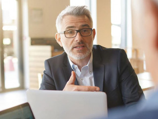 Work colleagues discussing ideas in informal business meeting