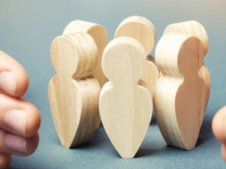 Boss defending his team with a gesture of protection. Life insurance. Customer care, care for employees. Security and safety in a business team. Human resources. A responsibility. Social protection