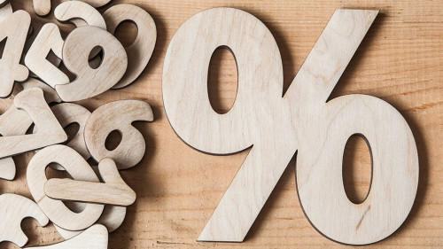 sign percent on wooden table