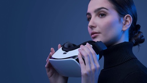 Beautiful woman holding a VR headset