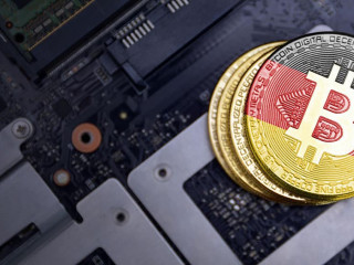 golden bitcoins with flag of germany on a computer electronic circuit board. bitcoin mining concept.