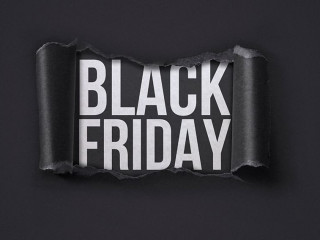 Black Friday promotional banner with torn paper hole