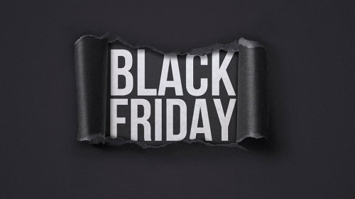 Black Friday promotional banner with torn paper hole