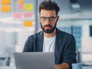 Modern Office: Portrait of Young Stylish Businessman Wearing Gla