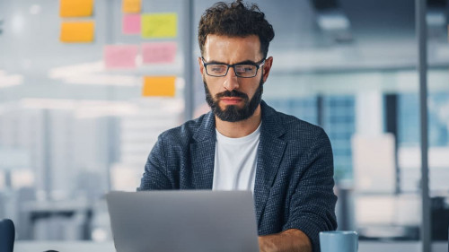 Modern Office: Portrait of Young Stylish Businessman Wearing Gla