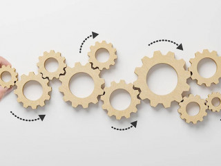 Business process and workflow automation with flowchart. Hand holding wooden cog flowing process management on white background