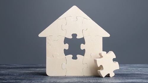 Puzzle house with a missing piece. The acquisition or construction comfortable dream home. Mortgage loan purchase real estate. Arrangement premises repair. Availability and cheapness. Finish building