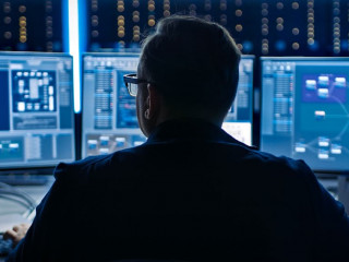 Professional IT Programer Working in Data Center on Desktop Comp