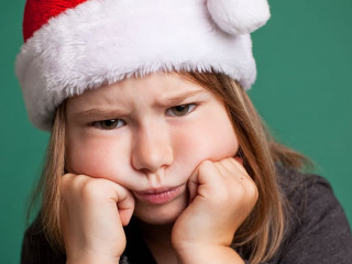 Grumpy Christmas Girl in Santa Hat, Isolated on Green