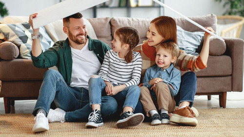 concept housing a young family. mother father and children in new home