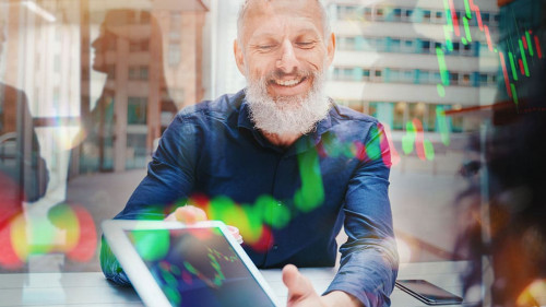 Businessman shows trading stock market chart on a tablet