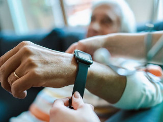 Smartwatch for assisted living. A woman from the medical health