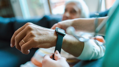 Smartwatch for assisted living. A woman from the medical health
