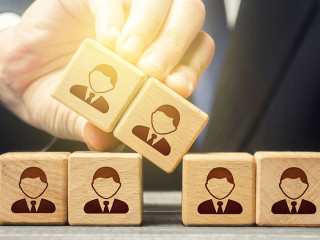 The man expands the team and adds new members. Company organization. Hiring workers. Leadership skills, team personnel management. Recruiting fresh employees for a large project. Accession cooperation