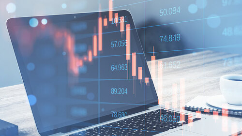 Close up of laptop with abstract falling candlestick forex chart on blurry background. Crisis, workplace and stock concept. Double exposure.