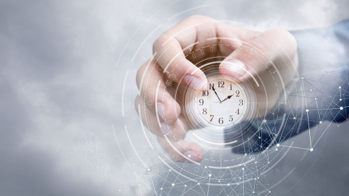 Hand of a businessman in the sky shows the clock .