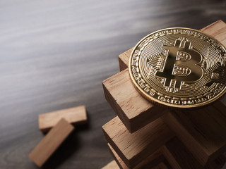 Bitcoin on the Wooden building blocks tower. Concept for bitcoin