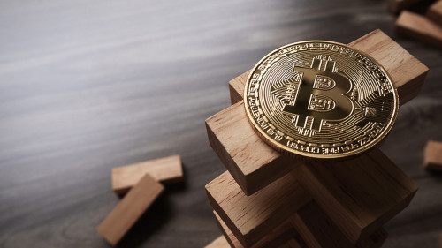 Bitcoin on the Wooden building blocks tower. Concept for bitcoin